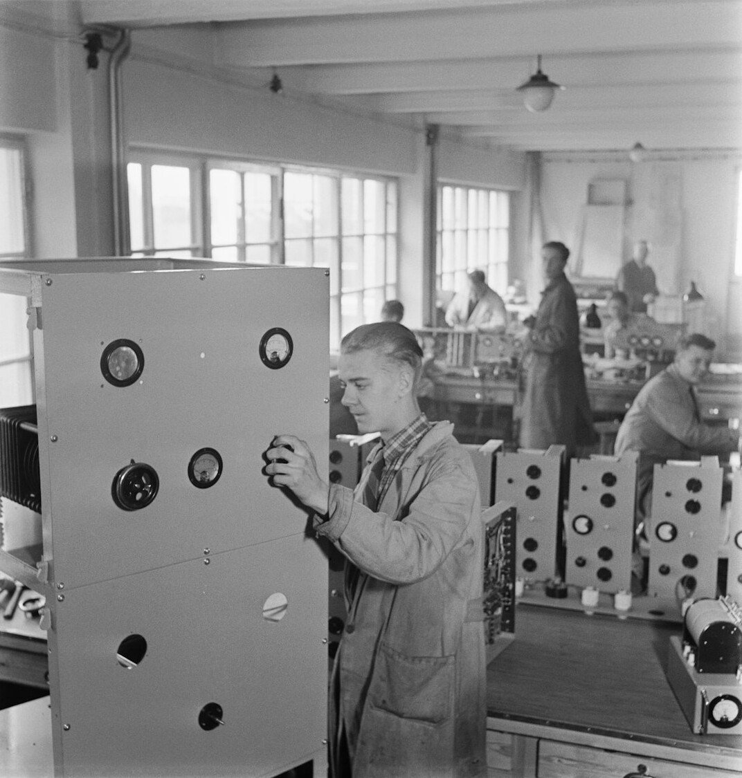Broadcast engineer working at a live signal routing panel